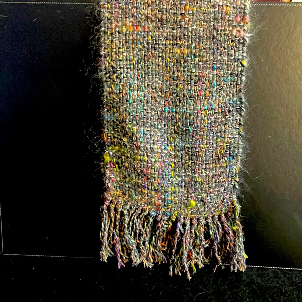 Handwoven 60 inch scarf.  Multi color’s predominately gray with colors woven